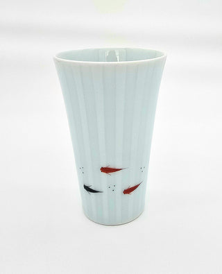 Toki Meki Workshop light blue porcelain cup with a subtle vertical stripe pattern and hand-painted medaka fish in red and black.