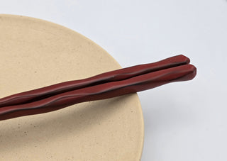 Toki Meki Workshop red lacquered wooden chopsticks, 21.5cm, with a traditional carved finish.
